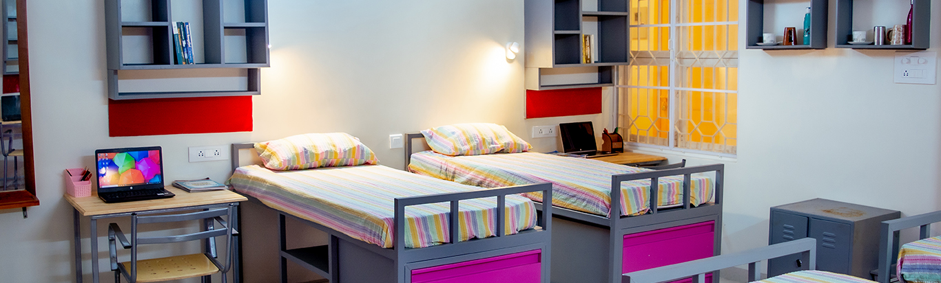 Colorful multi-share hostel room with beds